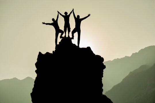 Business Team Celebrating Achievement and Success Together on Mountain Peak