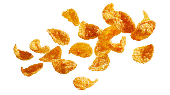Golden crispy corn flakes cereal pieces falling in the air
