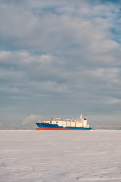 Winter shipping. Big cargo ships in frozen sea fairway