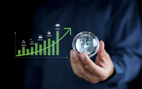 Businessman point to increasing arrow with carbon reduction for decrease CO2, carbon footprint and carbon credit to limit global warming from climate change, Bio Circular Green Economy concept.