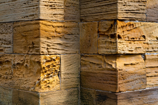Close-up of the weathered sandstone masonry of historic St Mary&rsquo;s Church in Whitby, North Yorkshire, England, beside the famous churchyard associated with Bram Stoker&rsquo;s Dracula.