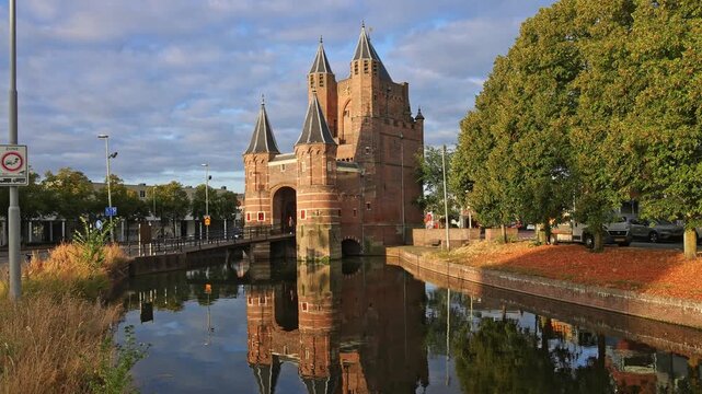 Scenic view of medieval Amsterdamse Poort city gate with water reflection in Haarlem, Netherlands on 16 August 2026.
