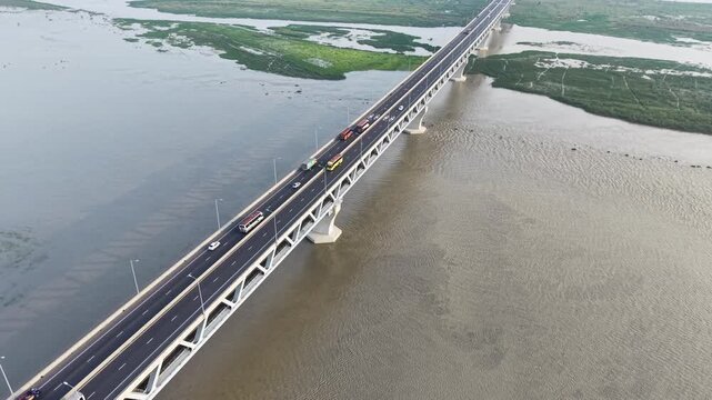 Aerial Footage of Buses, Cars and Trucks Crossing Padma Bridge, Bangladesh
