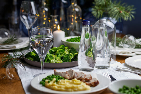 Holiday dinner table setting with healthy christmas meal