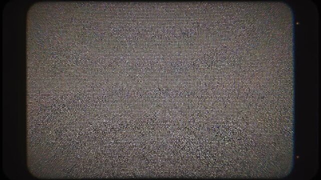 Vintage television static with film reel and test pattern during broadcast disruption