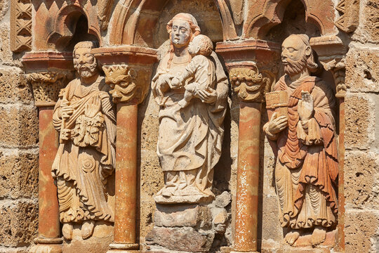 Chapel facade sculptures detail Santa Maria de Piasca. Cantabria, Spain