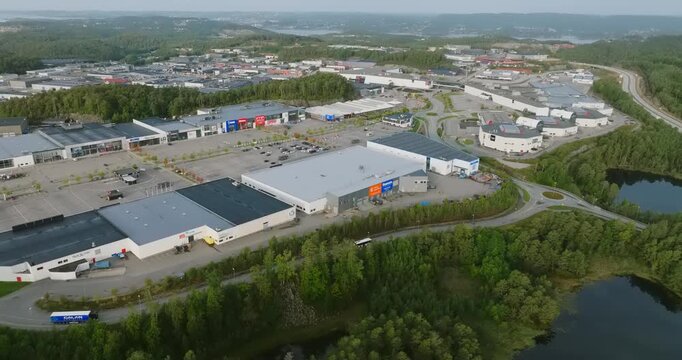 Aerial view of S&oslash;rlandsparken commercial district in Kristiansand Norway in slow motion showing grey pavement