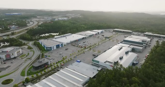 Aerial view of S&oslash;rlandsparken commercial district in Kristiansand Norway in slow motion showing urban landscape