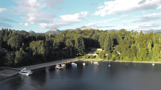 4K drone aerial view of Bah&iacute;a San Patricio in Villa La Angostura, Neuqu&eacute;n, Argentina. Crystal-clear waters of Lake Nahuel Huapi meet lush Patagonian forests and spectacular mountain scenery.