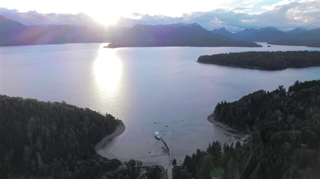 4K drone aerial view of Bah&iacute;a San Patricio in Villa La Angostura, Neuqu&eacute;n, Argentina. Crystal-clear waters of Lake Nahuel Huapi meet lush Patagonian forests and spectacular mountain scenery.
