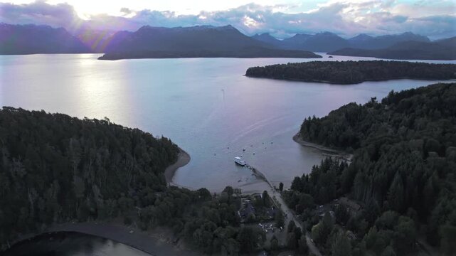 4K drone aerial view of Bah&iacute;a San Patricio in Villa La Angostura, Neuqu&eacute;n, Argentina. Crystal-clear waters of Lake Nahuel Huapi meet lush Patagonian forests and spectacular mountain scenery.