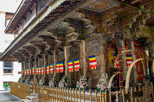 Ornate wooden carved shrine pavilion and elephant tusks at Temple of the Tooth in Kandy, Sri Lanka. The Temple of the Sacred Tooth Relic, known locally as Sri Dalada Maligawa