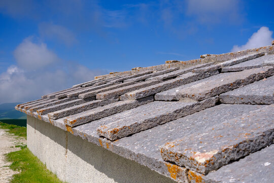 Traditional stone roof of a rural farmhouse in Lessinia hills, Veneto, Italy