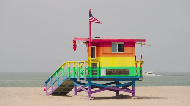 Colorful beach lifeguard hut beside the Pacific Ocean in California