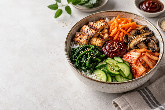Korean tofu bibimbap bowl with copy space