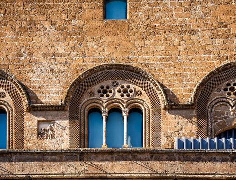 Trefoil window in the facade of the medieval Palazzo del Popolo in Piazza del Popolo, built at the end of the 13th century as the seat of civic government, Orvieto, Umbria, Italy