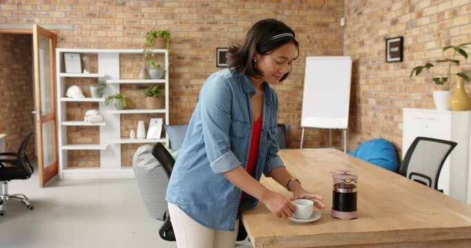 Lifestyle videos indoor of people doing activities at office, drinking coffee, woman standing in mod