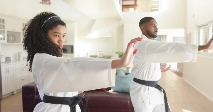Lifestyle videos indoor of people doing activities at home, practicing martial arts, man and woman o