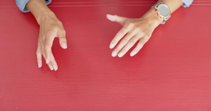 Close up of people talking to the camera, gesturing with hands, person wearing wristwatch on red tab