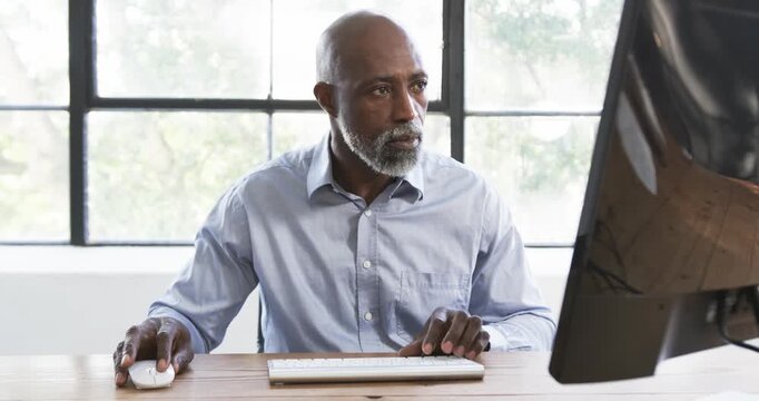 Lifestyle videos indoor of people doing activities at office, using computer mouse and keyboard, man