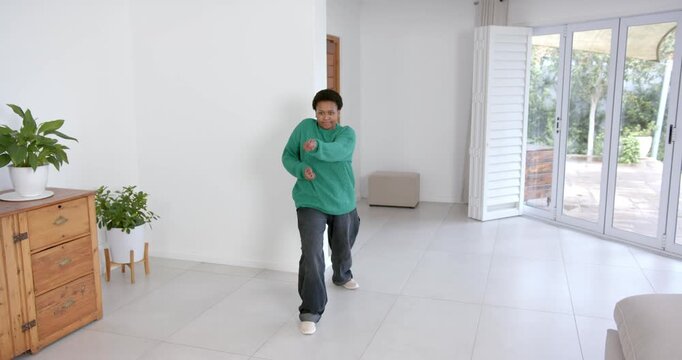 High speed photography for dynamic scenes, in living room, woman moving at home