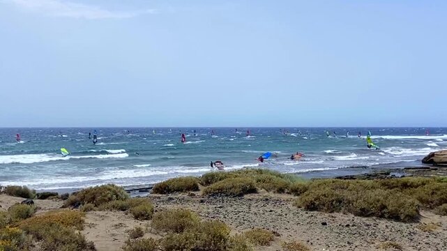 Windsurfing on Playa de Jaquita sandy beach near El Medano resort in Tenerife, Canary Islands,Spain.Travel, vacation concept,4K