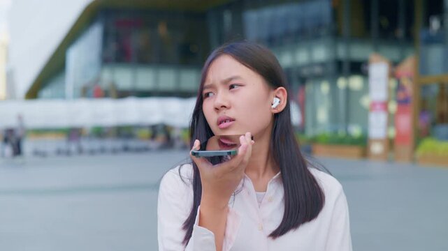 woman talking and command an AI voice assistant on a smartphone as a conceptual backdrop for artificial intelligence technology communication phone innovation virtual assistant and smart lifestyle