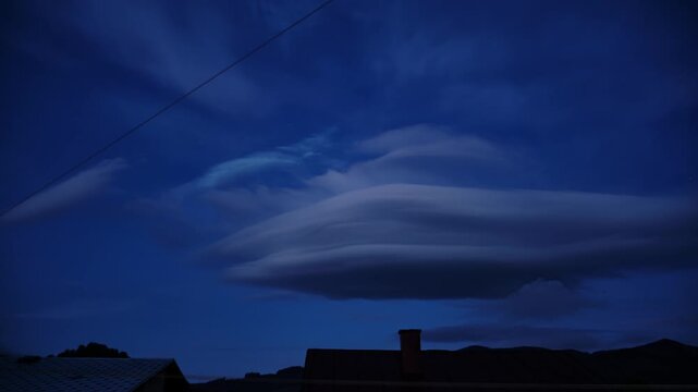 Timelapse Of Lenticular Clouds Forming In Dark Blue Evening Sky