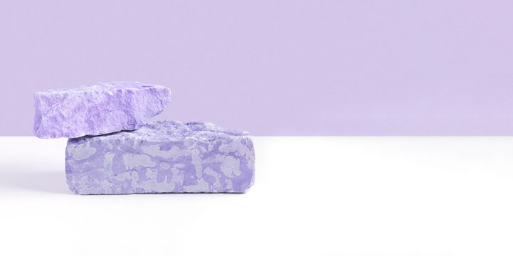 Stone Podium for promotion on violet Background. Natural pedestal. Two stone podiums. Beauty product mockup. Scene to show products. Showcase, display case. Front View, soft shadow. Rock. Very peri