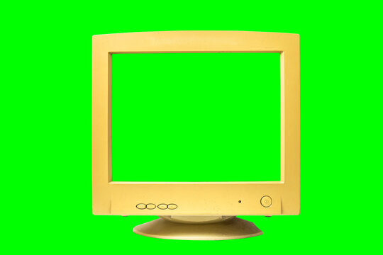 Old computer monitor with green screen isolated on green background. Vintage crt empty blank mockup green screen monitor. Front View