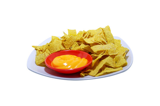 Crunchy corn tortilla nachos chips served with melted cheese sauce isolated on plain background