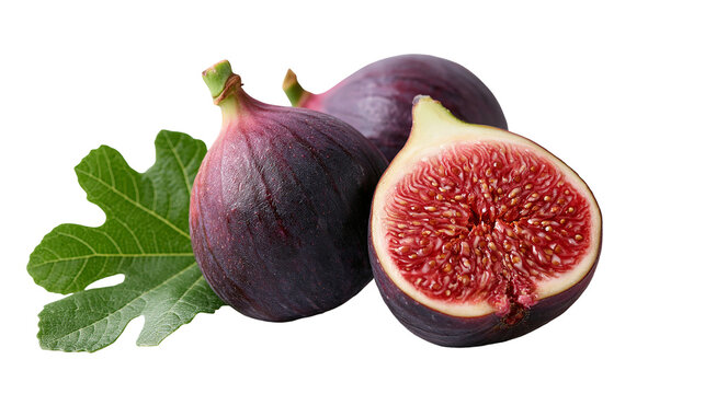 Fresh whole and halved purple figs with a green leaf