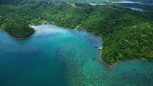 Cinematic land and aerial footage at Cagraray Eco Park in Albay, featuring the local church, tropical surroundings and scenic island landscape beneath sunny skies.