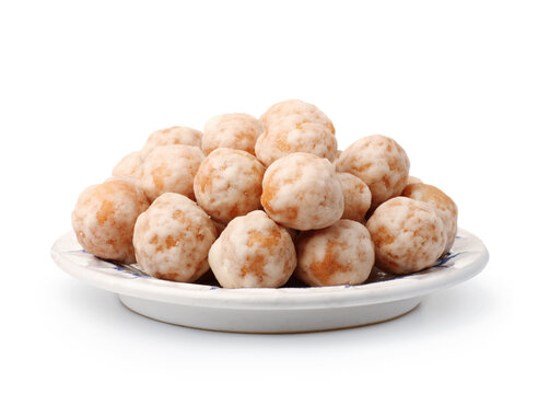 Traditional glazed baursak pastry on ceramic plate