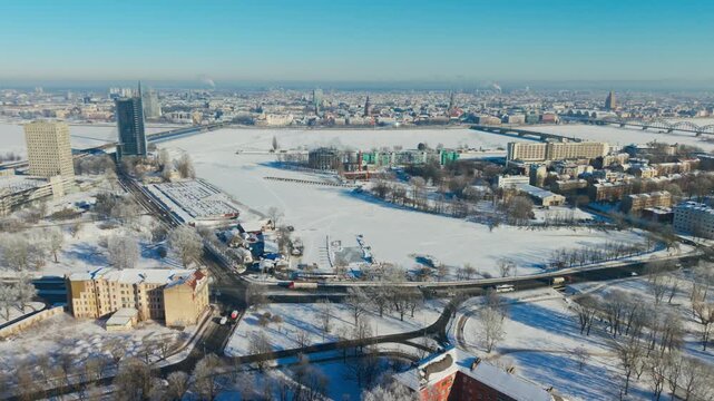 Frozen Daugava Frames Riga Old Town as Latvian flag flies above the winter city