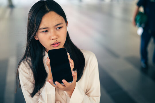 woman talking and command an AI voice assistant on a smartphone as a conceptual backdrop for artificial intelligence technology communication phone innovation virtual assistant and smart lifestyle