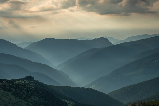 Moody Mountain Layers and Cloudy Sky in Romanian Carpathians