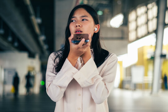 woman talking and command an AI voice assistant on a smartphone as a conceptual backdrop for artificial intelligence technology communication phone innovation virtual assistant and smart lifestyle