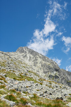 Stunning view of the Lomnicky Stit peak located in the High Tatras mountains of Slovakia on a sunny day