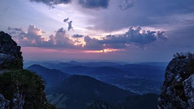 Timelapse Of Sunset Rays And Clouds Over Mountain Range From Rocky Peak