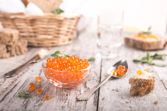 Glass bowl with red caviar. Helthy food.
