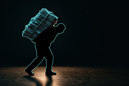 Silhouette carrying a huge glowing stack of paper, burden concept