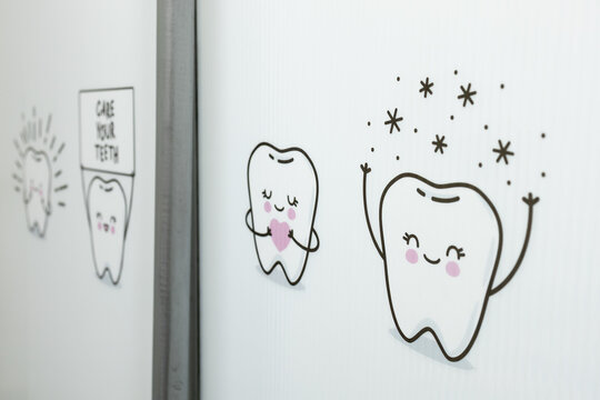 Cartoon Teeth with Stars sticker on the dentist office plastic wall