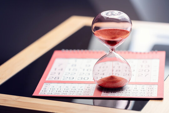 Hourglass on top of calendar