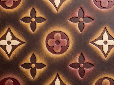 Handcrafted leather texture with embossed floral pattern and gradient tones