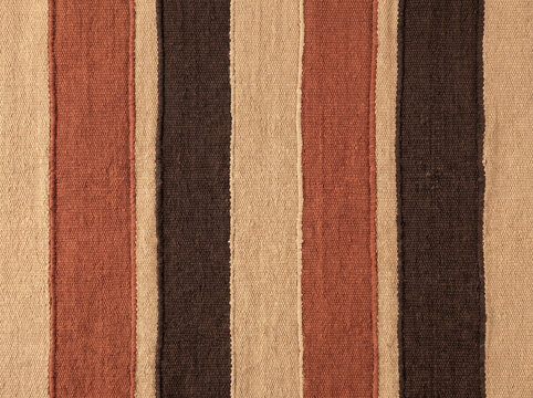 Vertical striped fabric texture with brown and beige woven textile pattern