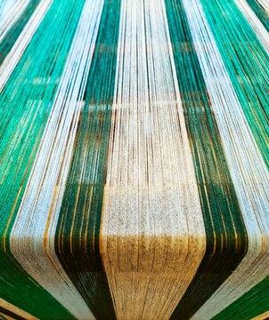 Colorful threads stretching creating fabric background