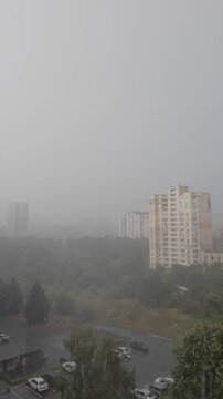 Heavy Fog and Rain Obscuring Residential Buildings During Urban Storm