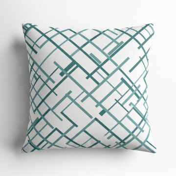 Decorative throw pillow with geometric teal grid pattern on white textile fabric