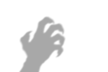 A dark scary shadow of a clawed hand reaching out in a menacing gesture representing fear and horror isolated on isolated on transparent background © AHAMMED